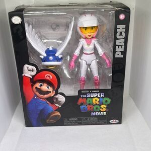 NIB Nintendo The Super Mario Bros Movie Deluxe Action Figure Princess PEACH